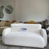 2-Seater sofa made with white boucle fabric