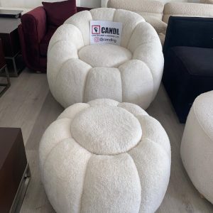 Off-white bouclé round sofa with a matching pouffe