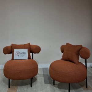 Oval-shaped burnt orange accent chair
