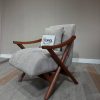 Grey accent chair with wooden legs