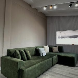 L-shaped green sofa