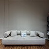 4-seater sofa with a sturdy wooden base and stylish wooden stand